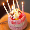 Birthday cake with candles. Birthday quotes for greeting cards messages.